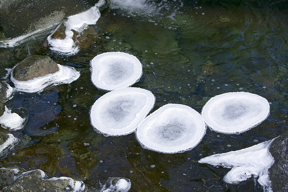 A partially frozen river in Easedale near Grasmere in the Lake District National Park, Cumbria, England, United Kingdom, Europe