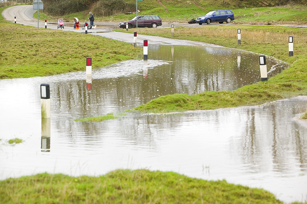 A flooded road near Sunderland Point, Morecambe Bay, Lancashire, England, United Kingdom, Europe