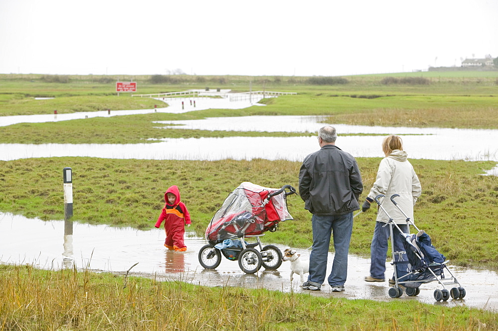 A flooded road near Sunderland Point, Morecambe Bay, Lancashire, England, United Kingdom, Europe