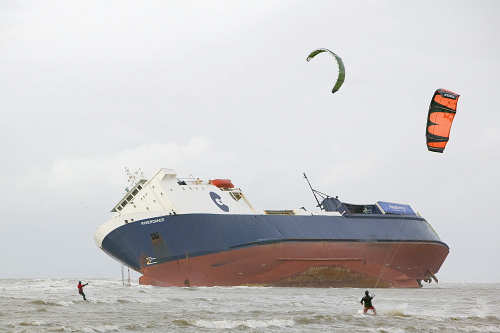 Kite surfers in front of The Riverdance, a ship washed ashore off Blackpool, Lancashire, England, United Kingdom, Europe