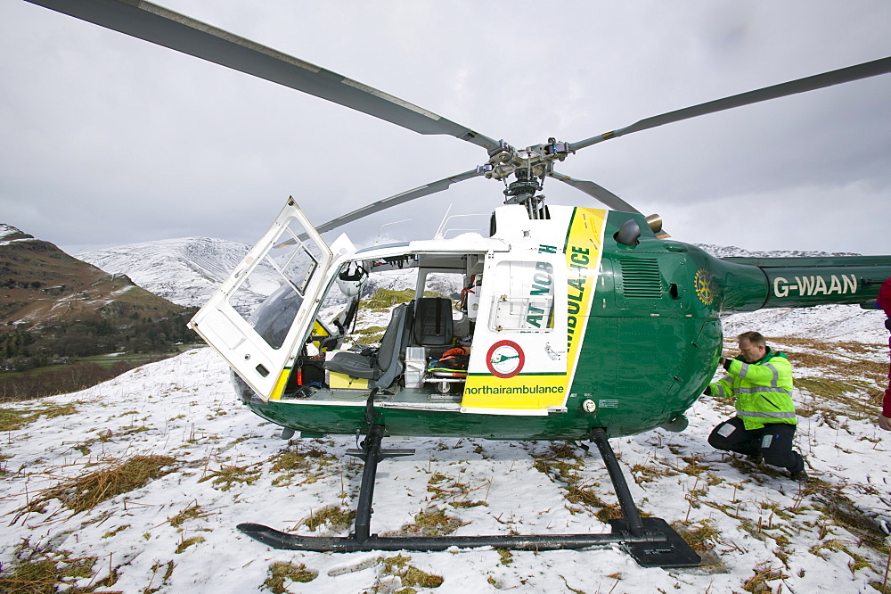 An air ambulance at the site of an injured walker on Silver Howe above Grasmere, Lake District, Cumbria, England, United Kingdom, Europe