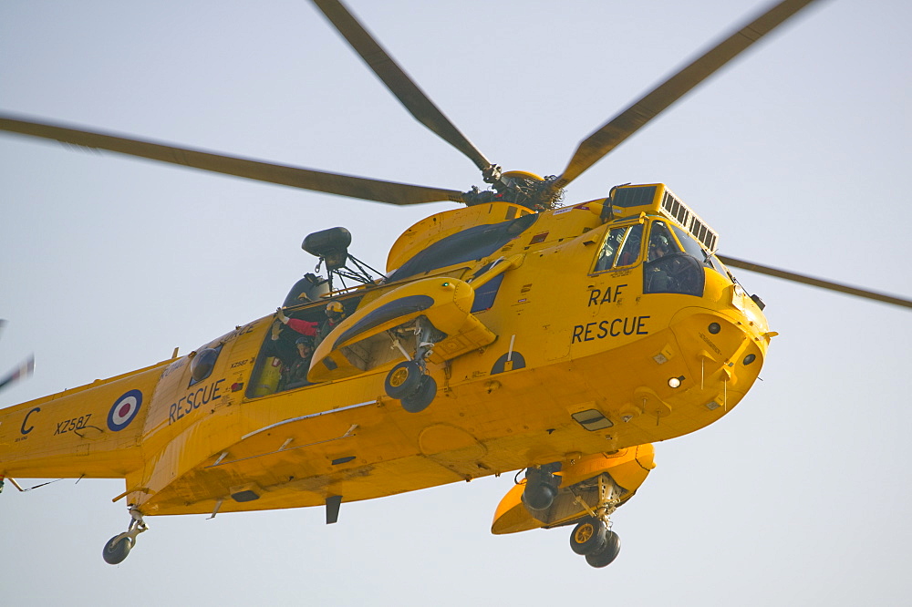 An RAF Sea King helicopter flying over the Langdale Valley in the Lake District, Cumbria, England, United Kingdom, Europe