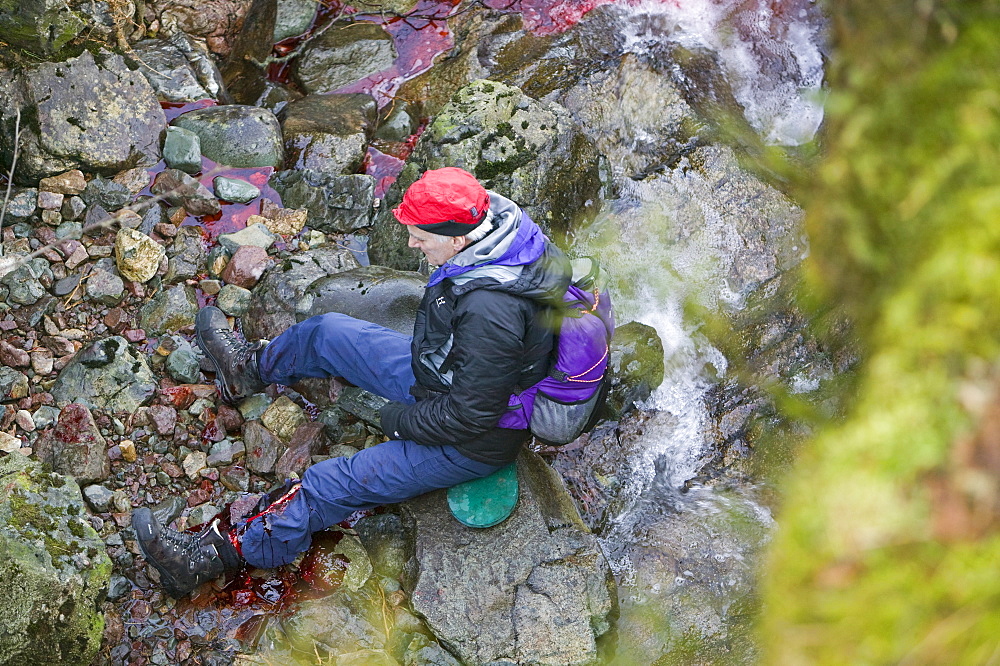 A walker with a badly shattered leg in Dungeon Ghyll, Langdale, Lake District, Cumbria, England, United Kingdom, Europe