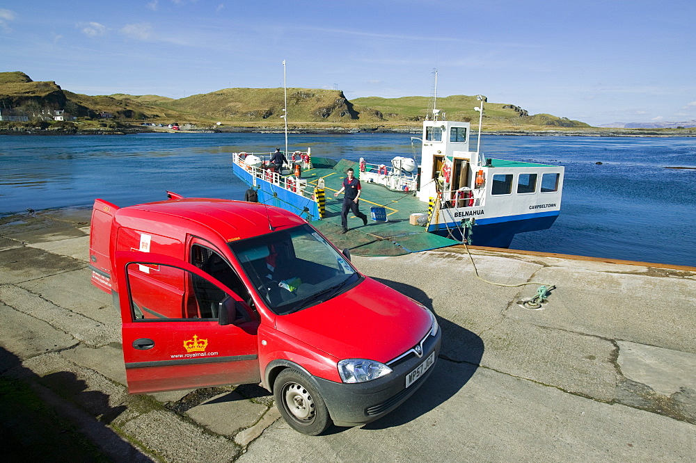 The postman loading the post onto the ferry at Cuan from Seil Island to Luing Island, Slate Islands, Firth of Lorn, Argyll, Scotland, United Kingdom, Europe