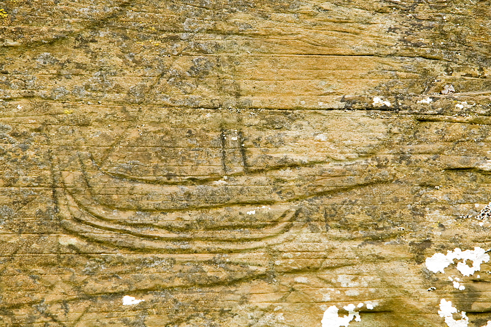 An ancient carved outline of a Birlinn and ship introduced by the Norse to Scotland on an ancient chapel near Toberonochy, Isle of Luing, Slate Islands, Argyll, Scotland, United Kingdom, Europe