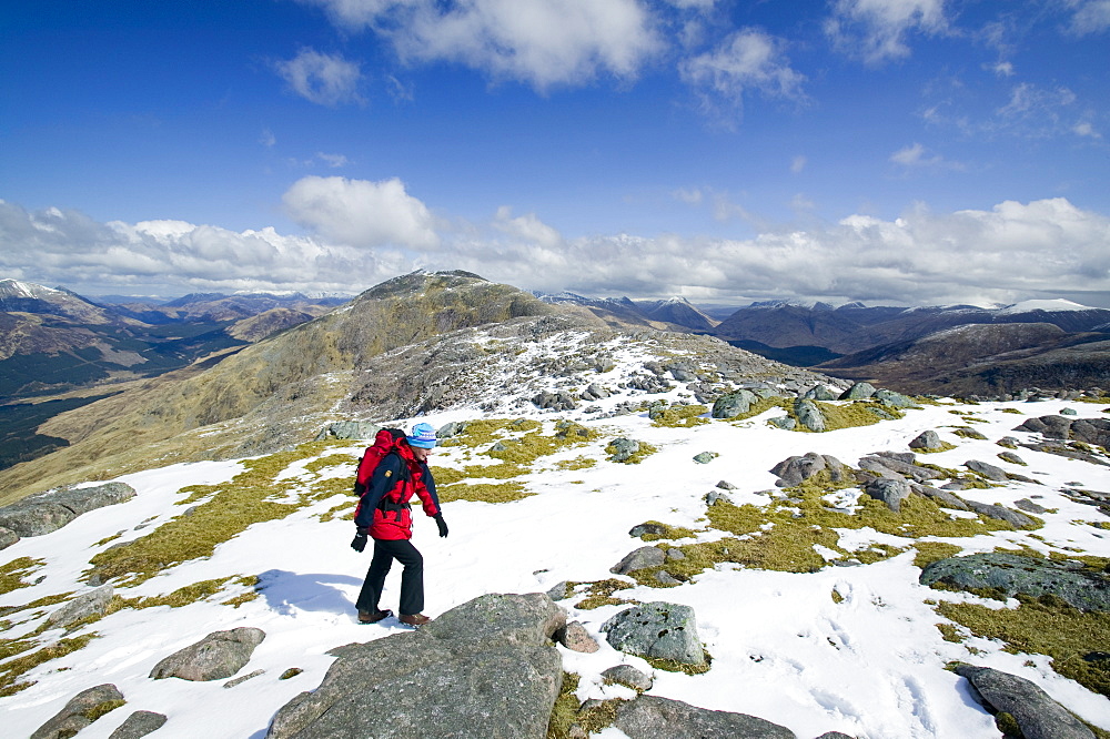 A woman near the summit of the Munro Beinn Sgulaird above Glen Creran between Oban and Glen Coe, Scotland, United Kingdom, Europe