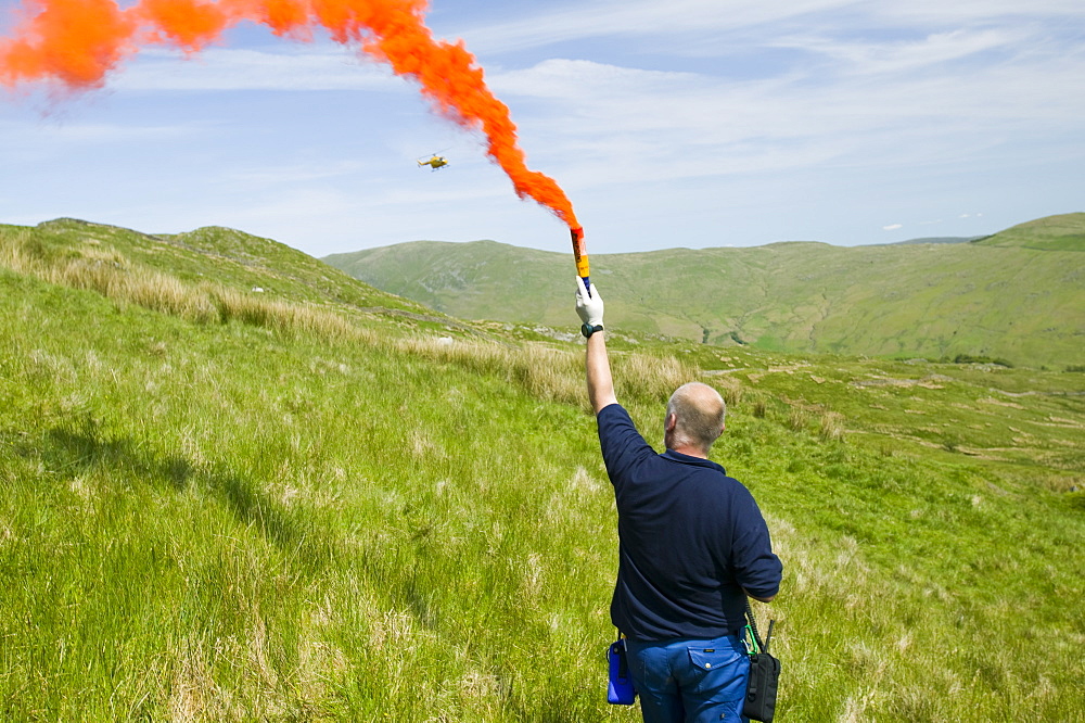 An air ambulance attends a mountain rescue on Wansfell, Lake District, Cumbria, England, United Kingdom, Europe