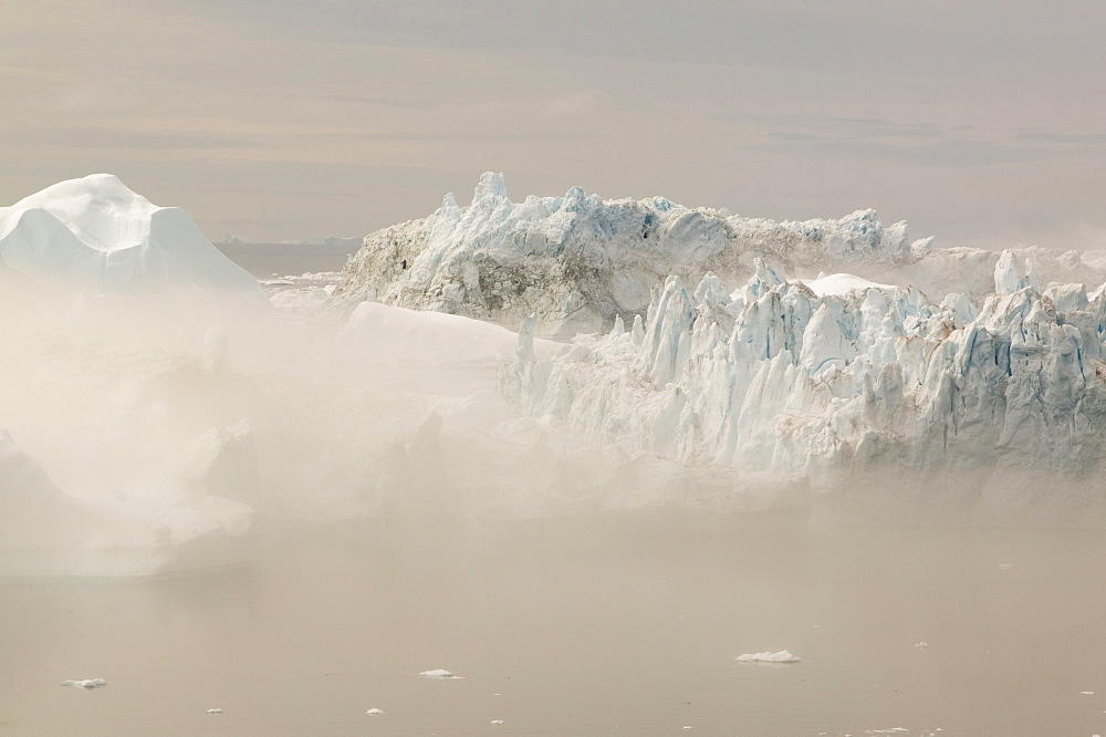 Mist over icebergs from the Jacobshavn Glacier (Sermeq Kujalleq), Greenland, Polar Regions