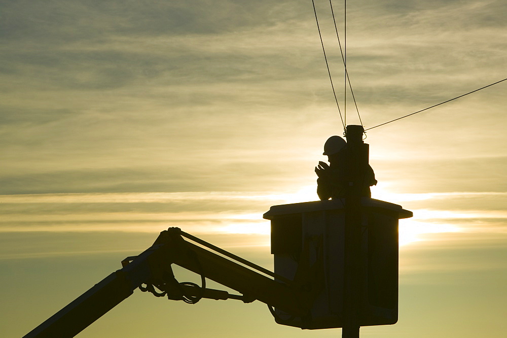 A BT worker fixs telephone lines, Cumbria, England, United Kingdom, Europe