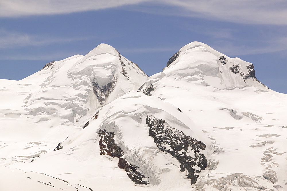 The twin peaks of Castor and Pollux above Zermatt, Switzerland, Europe