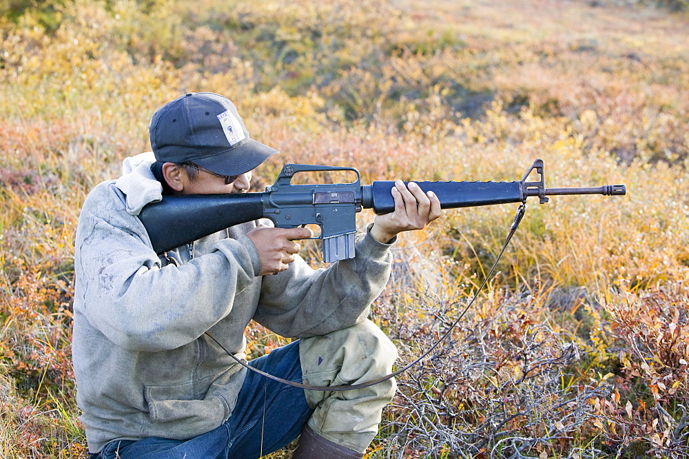 J J Weyouanna hunting Caribou on the tundra at the mouth of the Serpentine river near Shishmaref, a tiny island inhabited by around 600 Inuits, between Alaska and Siberia in the Chukchi Sea, United States of America, North America