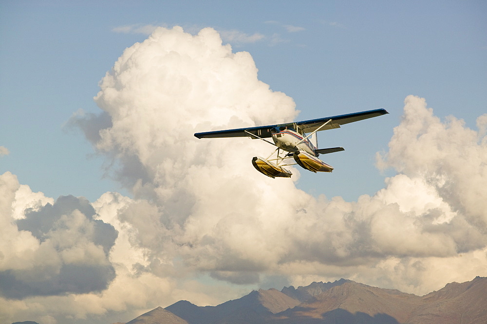 A float plane flying into Anchorage, Alaska, United States of America, North America