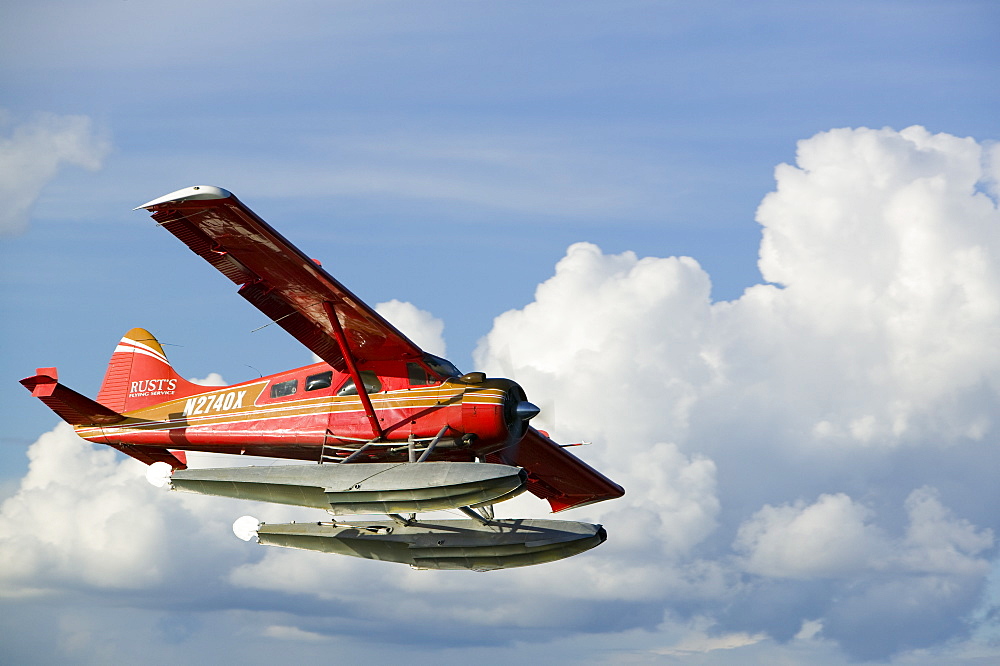 A float plane flying into Anchorage, Alaska, United States of America, North America