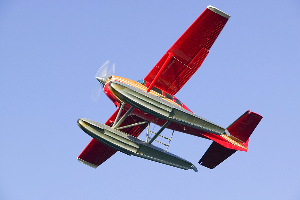 A float plane flying into Anchorage, Alaska, United States of America, North America