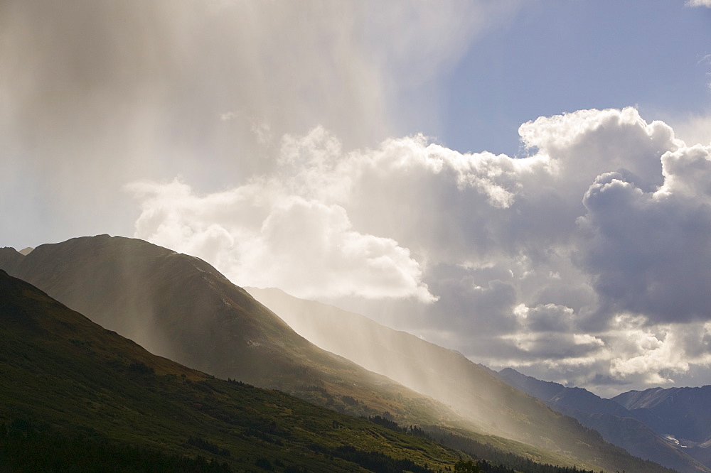 A shower over Turnagain Pass in the Chugach Mountains in Alaska, United States of America, North America