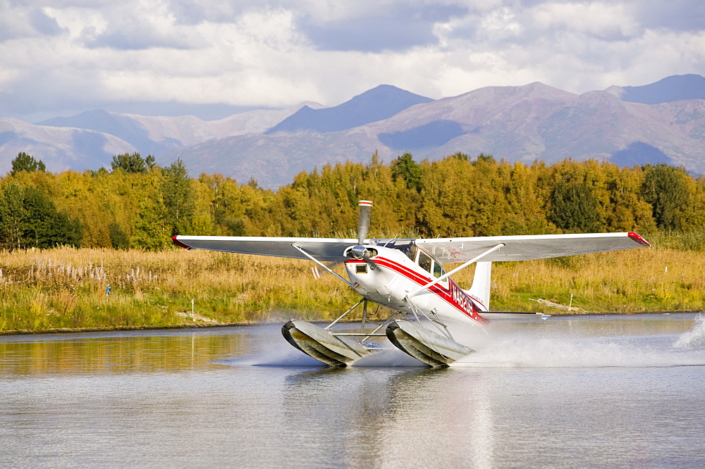 A float plane flying into Anchorage, Alaska, United States of America, North America