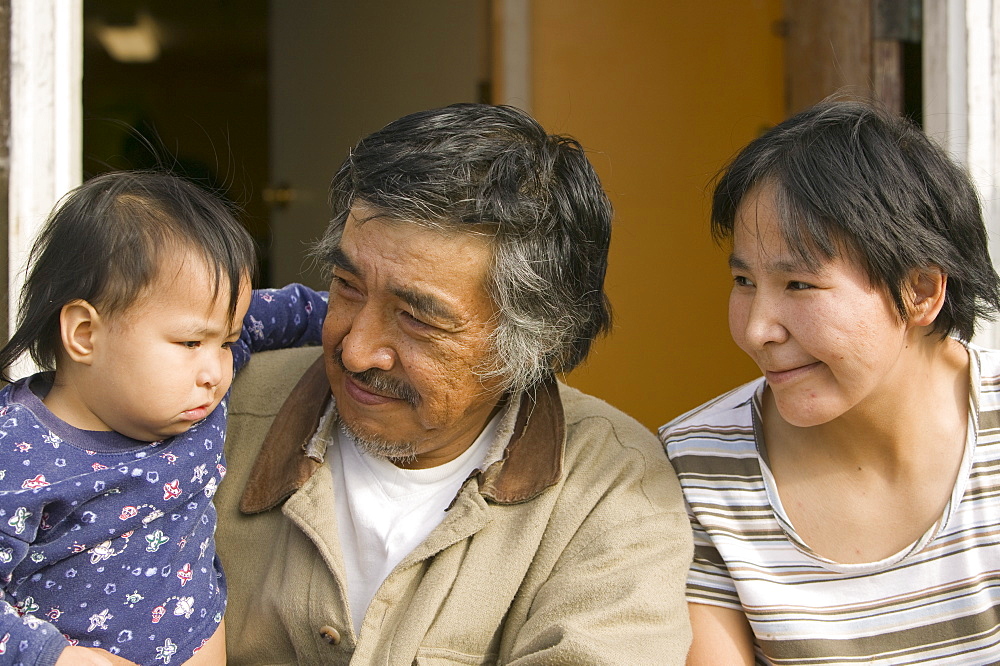 Three generations of an Inuit family on Shishmaref, aa tiny island inhabited by around 600 Inuits, between Alaska and Siberia in the Chukchi Sea, United States of America, North America