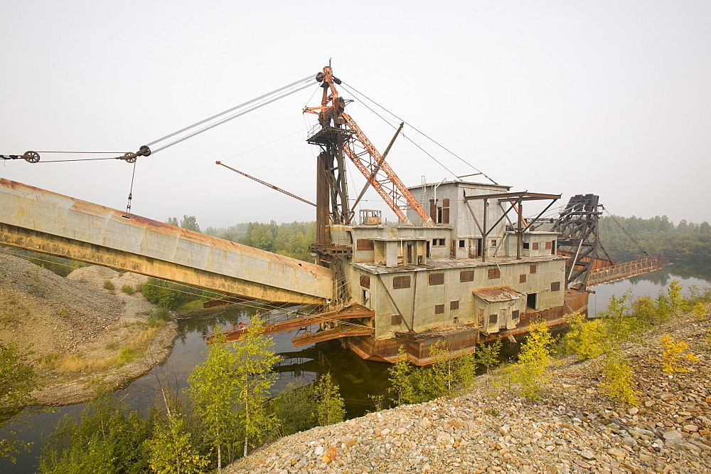 An abandoned gold dredger on the tundra near Fairbanks, Alaska, United States of America, North America