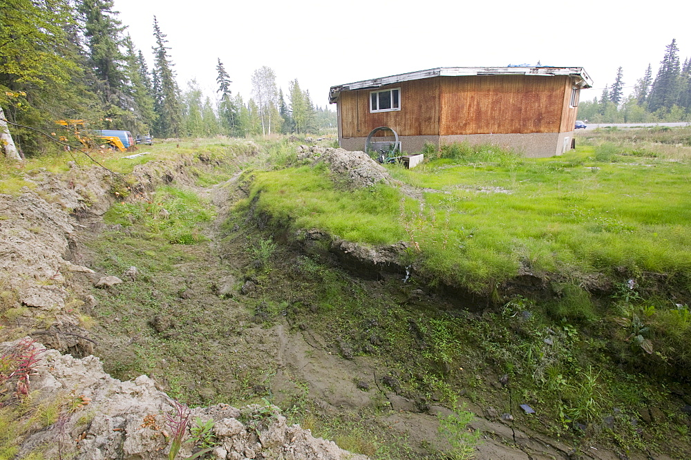 House collapsing due to global warming-induced permafrost melt, Fairbanks, Alaska, United States of America, North America