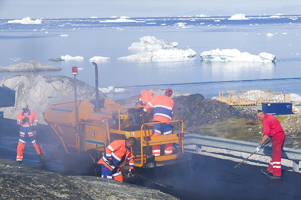 Laying tarmac on a road in Ilulissat on Greenland, Polar Regions