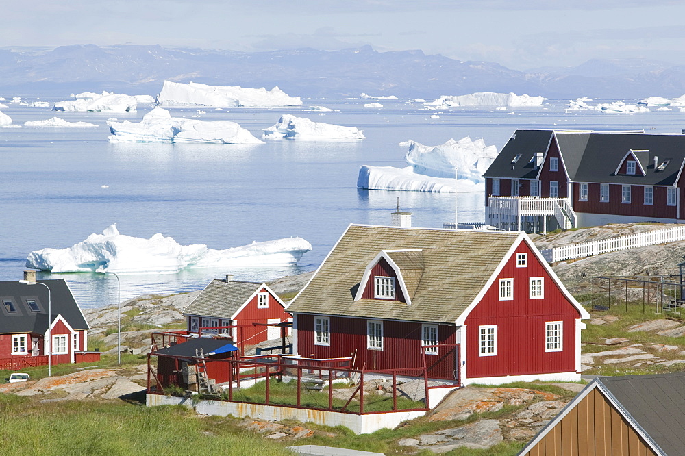 Icebergs and houses in Ilulissat on Greenland, Polar Regions