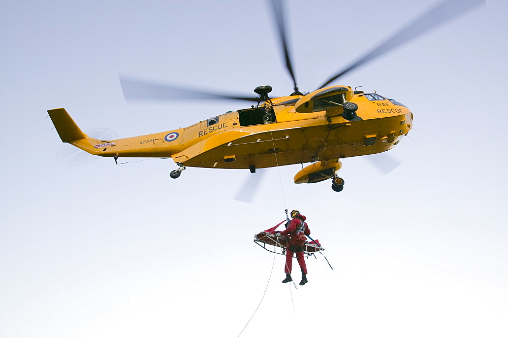 An RAF Sea King helicopter attends a mountain rescue incident in the Lake District, Cumbria, England, United Kingdom, Europe