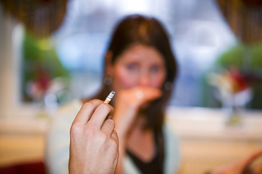 A woman objecting to a smoker