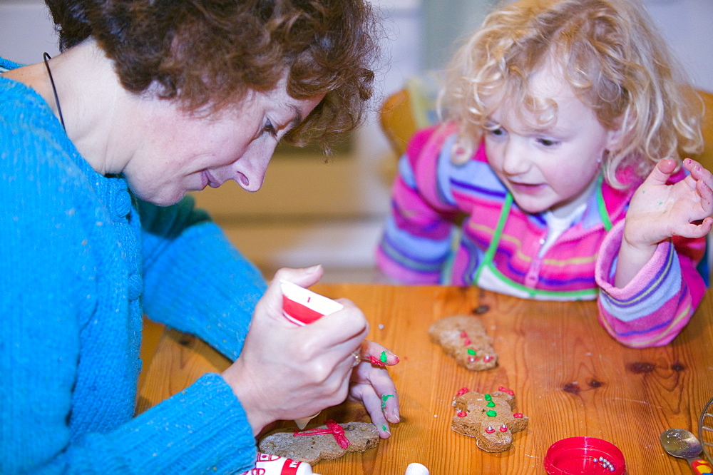 Children making Christmas cake decorations