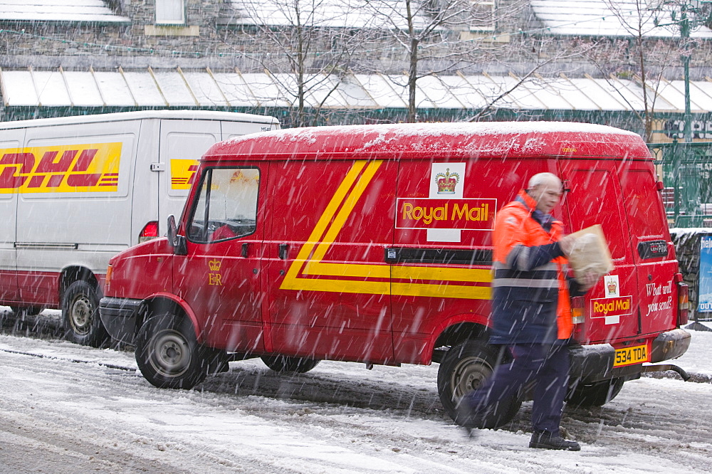 A postvan in snow in Ambleside, Cumbria, England, United Kingdom, Europe