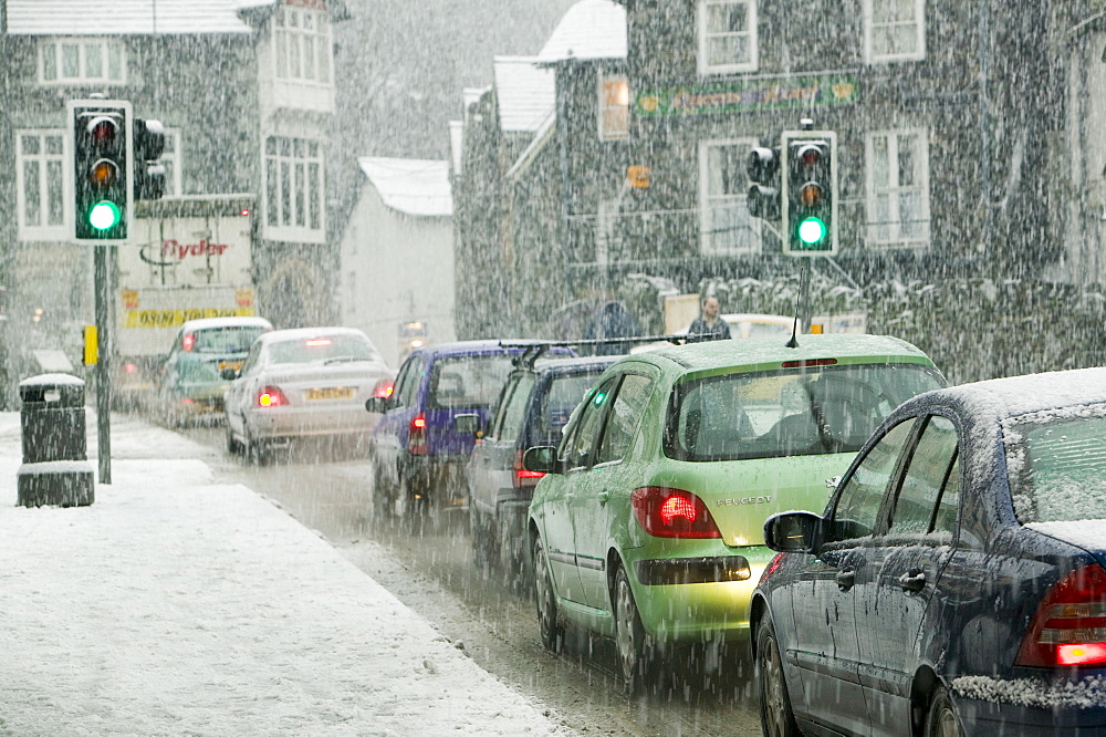 A car in the snow in Ambleside, Cumbria, England, United Kingdom, Europe