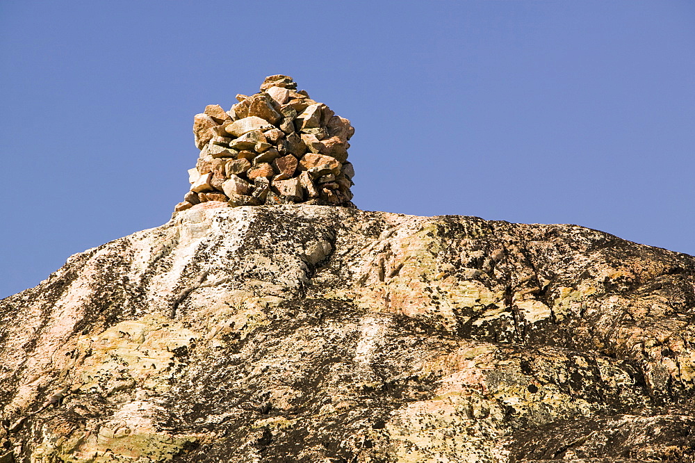 A cairn on a mountain summit above Ilulissat in Greenland, Polar Regions