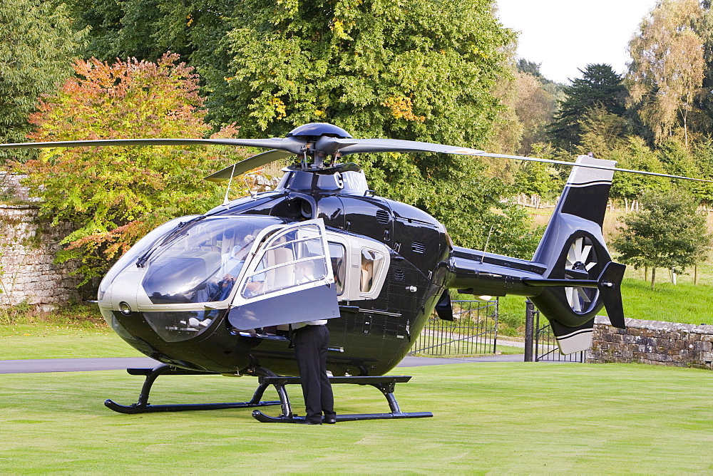 A private helicopter arriving at Narworth Castle in North Cumbria, England, United Kingdom, Europe