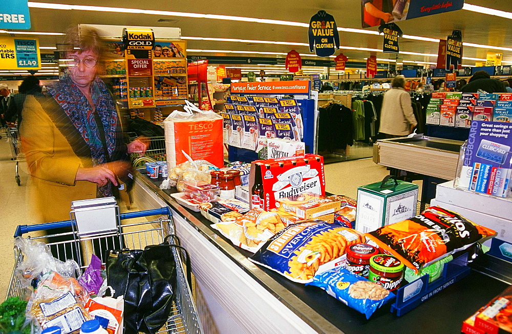 A shopper with the weekly food shop at Carlisle Tesco Supermaket, Cumbria, England, United Kingdom, Europe