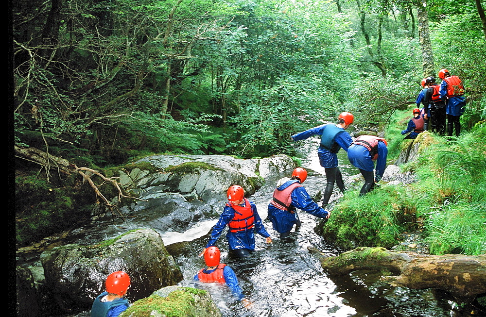 A group of teenagers canyoning in Mid Wales, United Kingdom, Europe