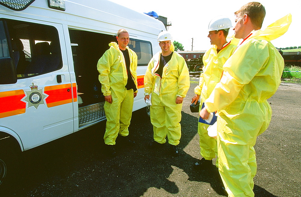 A group of police wearing protective suits in Carnforth, England, United Kingdom, Europe