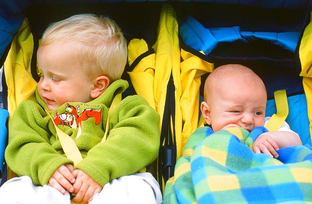 Young children in a push chair