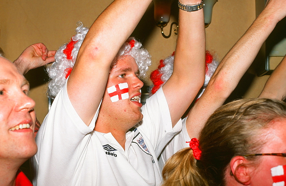 England football fans celebrate a goal in the World Cup