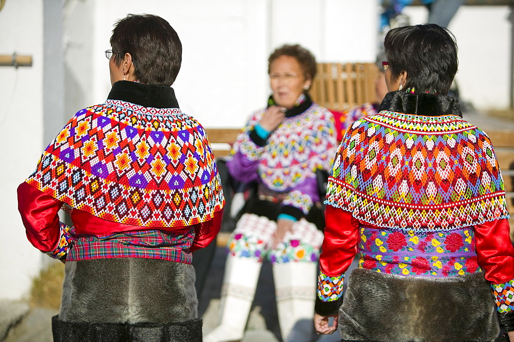 Inuit women wearing traditional Greenlandic national costume (Kalaallisuut) in Ilulissat on Greenland, Polar Regions