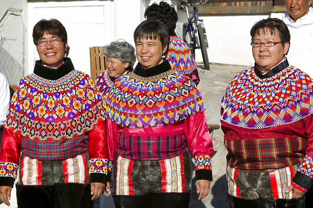 Inuit women wearing traditional Greenlandic national costume (Kalaallisuut) in Ilulissat on Greenland, Polar Regions