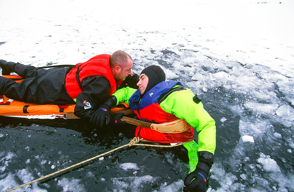 Members of the Langdale Ambleside Mountain Rescue Team rescue a man fallen through ice on Rydal Water in the Lake District National Park, Cumbria, England, United Kingdom, Europe