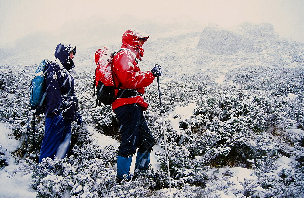 Women fell walkers in heavy snow on Quinag in Scotland, United Kingdom, Europe