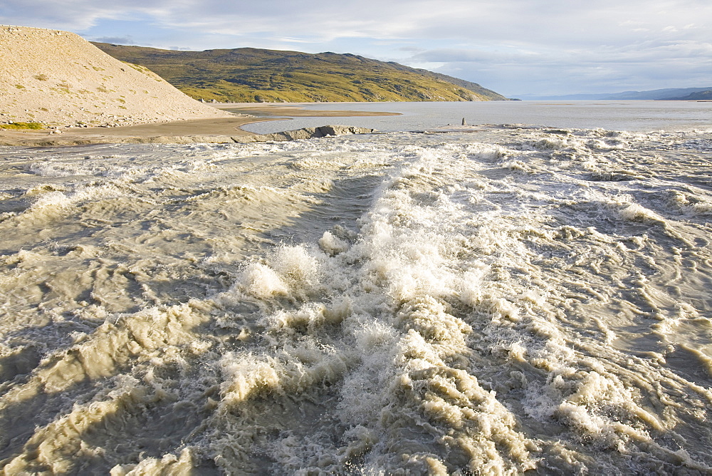 Meltwater from the Russell Glacier that drains the Greenland Ice Sheet 26 km inland from Kangerlussuaq, Greenland, Polar Regions