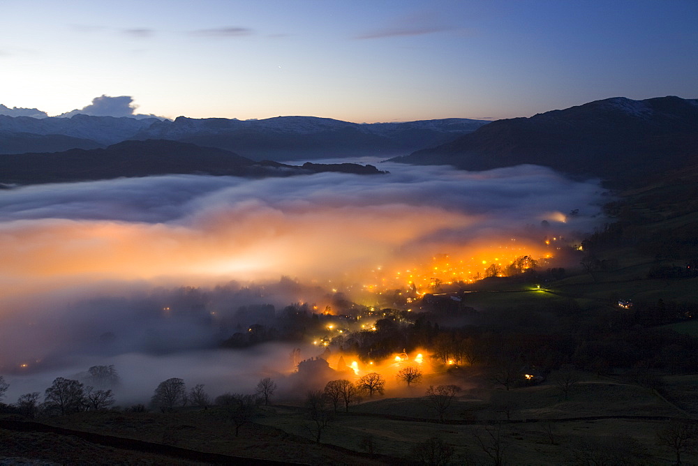 Valley mist over Ambleside from Wansfell Pike in the Lake District National Park, Cumbria, England, United Kingdom, Europe