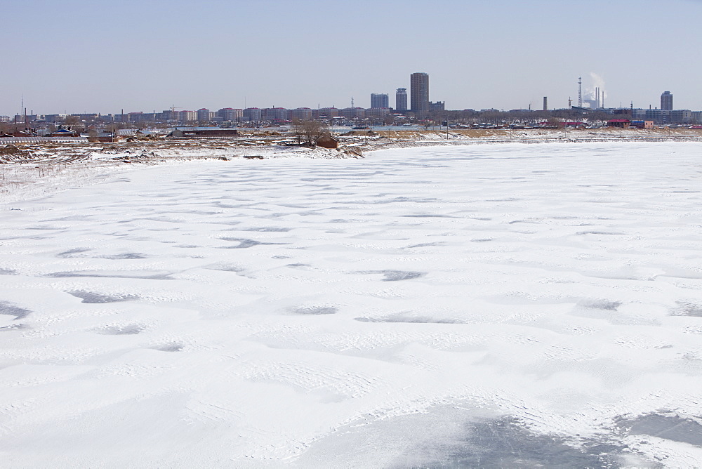 The Songhue river frozen solid in winter in Harbin, Heilongjian province, Northern China, Asia