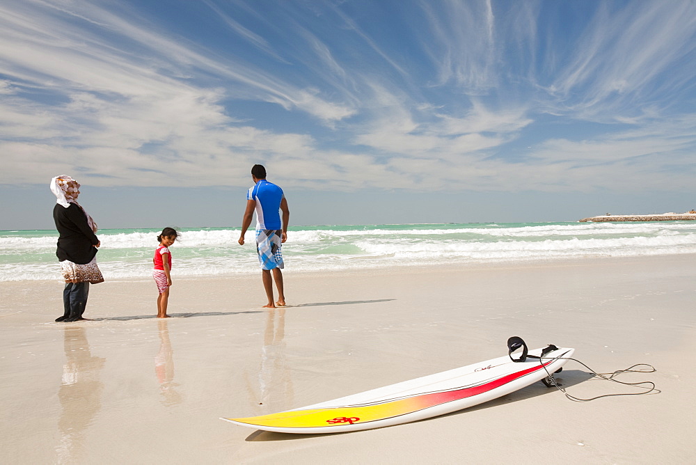 An Arab family on a public beach in Dubai, United Arab Emirates, Middle East