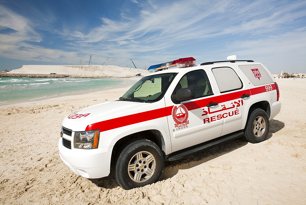 A police emergency vehicle on a public beach in Dubai, United Arab Emirates, Middle East