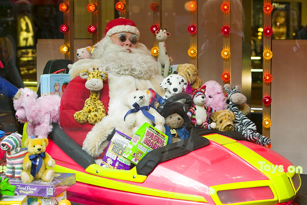 Father Christmas in a window display in a department store on Oxford Street in London, England, United Kingdom, Europe