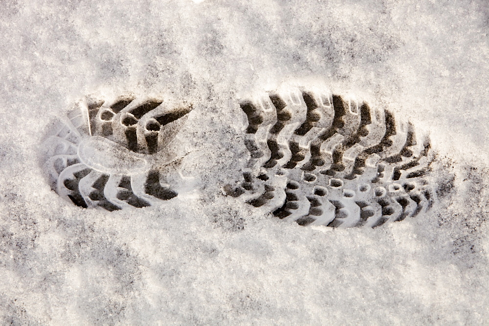 A bootprint in the snow in Ambleside, Cumbria, England, United Kingdom, Europe