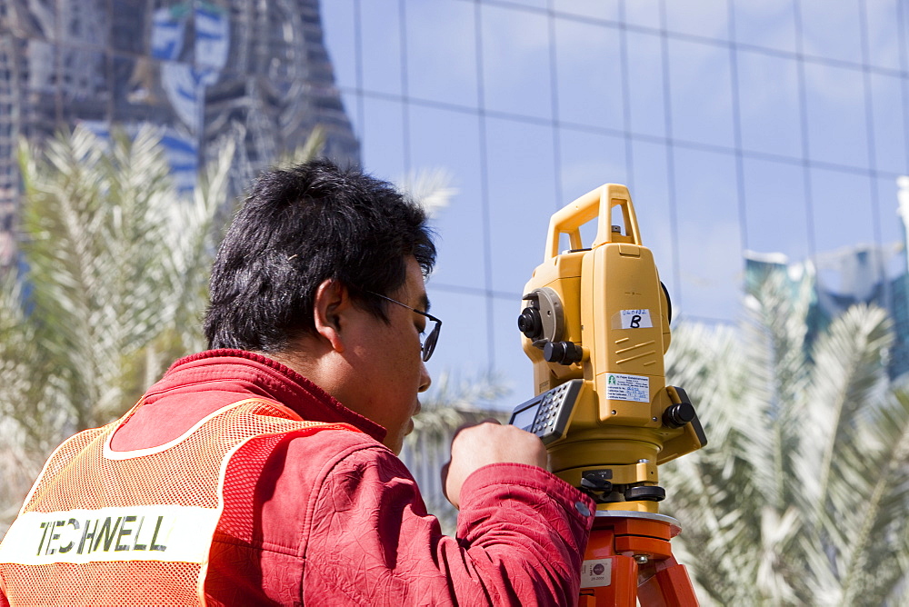 A surveyor working on a construction project in Dubai, United Arab Emirates, Middle East