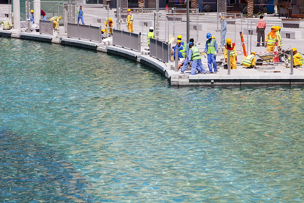 Construction workers working near the Burj Dubai in Dubai, United Arab Emirates, Middle East